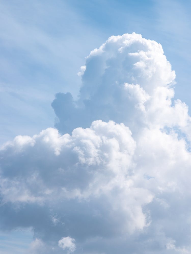 Soft white clouds in a blue sky - natural pattern - nature photography by Christa Stroo Photography