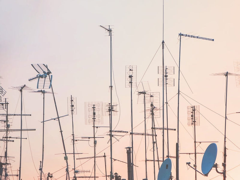 Rome, Italy I Graphic pattern of antennas over rooftops at sunset in a pink pastel summer sky light with minimalist and geometric cityscape photography evoking the poetic side of urban la dolce vita